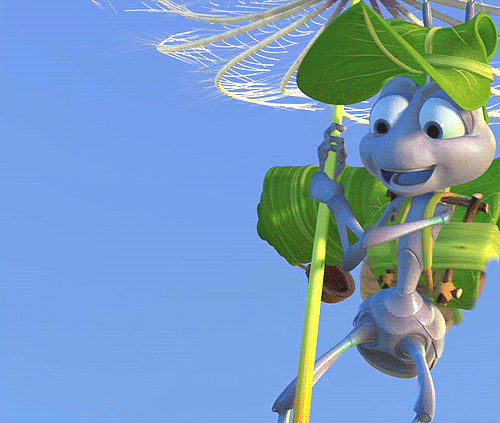 Flik from a A Bugs Life floating on a dandilion seed, smiling