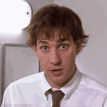 Jim Halpert from The Office smiling in stunned disbelief