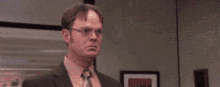 Dwight from The Office doing karate, and on every strike an emoji appears