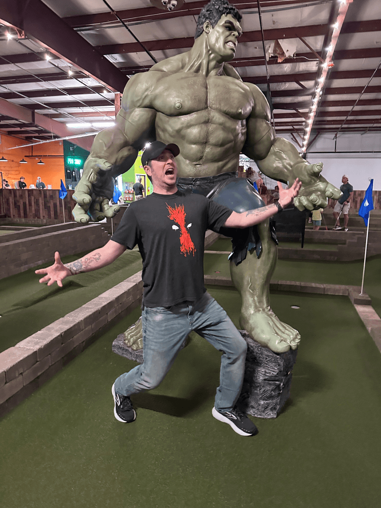 me and a life-size statue of Marvel's Hulk