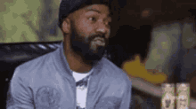 A man falling back in his chair speechless