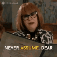 Moira Rose from Schitt's Creek saying, "Never assume, dear. It makes an ass out of both of us."