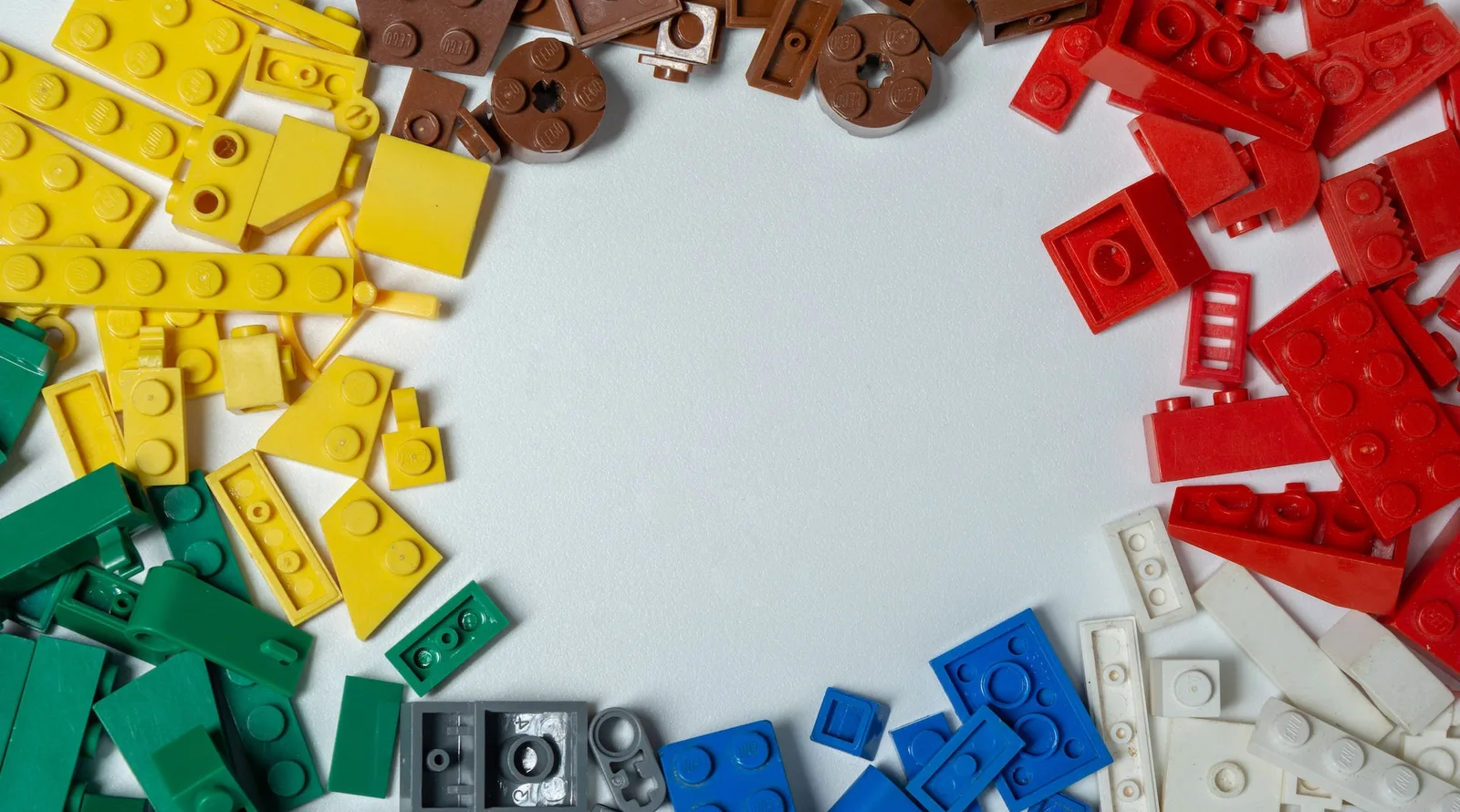 Lego of different colors spread out on a table